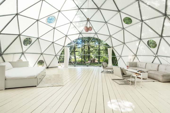 Dome interior with bed and seating area